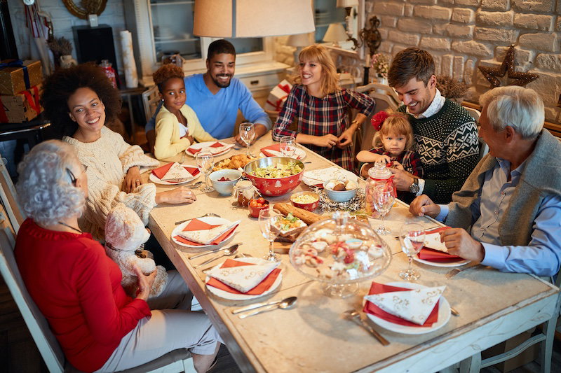 Happy Family and friends at  Christmas dinner.Christmas eve with traditional food.